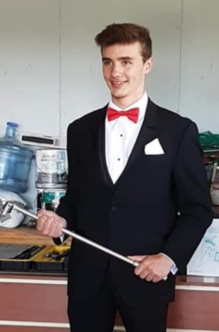 Tyler Mason in a Tuxedo with a red bowtie